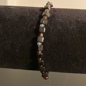 Black and amber colored beaded bracelet